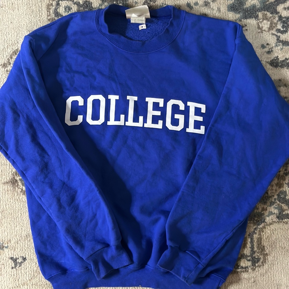 Blue Hanes crewneck sweatshirt with "College" on the front